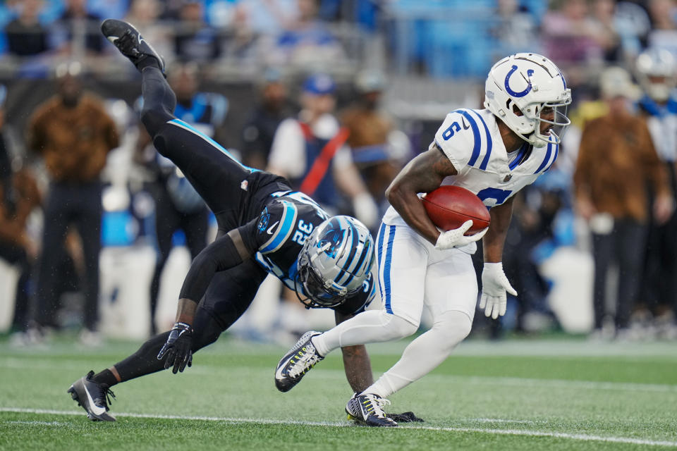 Indianapolis Colts wide receiver Isaiah McKenzie runs past Carolina Panthers cornerback Dicaprio Bootle during the first half of an NFL football game Sunday, Nov. 5, 2023, in Charlotte, N.C. (AP Photo/Rusty Jones)