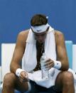 Juan Martin Del Potro of Argentina cools off during his men's singles match against Rhyne Williams of the United States at the Australian Open 2014 tennis tournament in Melbourne January 14, 2014. REUTERS/Bobby Yip