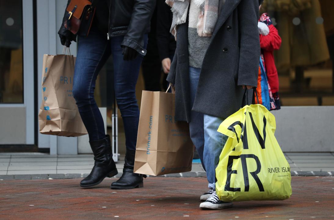 File photo dated 26/12/20 of people carrying shopping bags. British retailers saw sales rise last month as summer discounts and warmer weather helped boost clothes stores and supermarkets, according to official estimates. Retail sales volumes, which measure the quantity bought, rose by 1% in August, the Office for National Statistics (ONS) said. Issue date: Friday September 20, 2024.