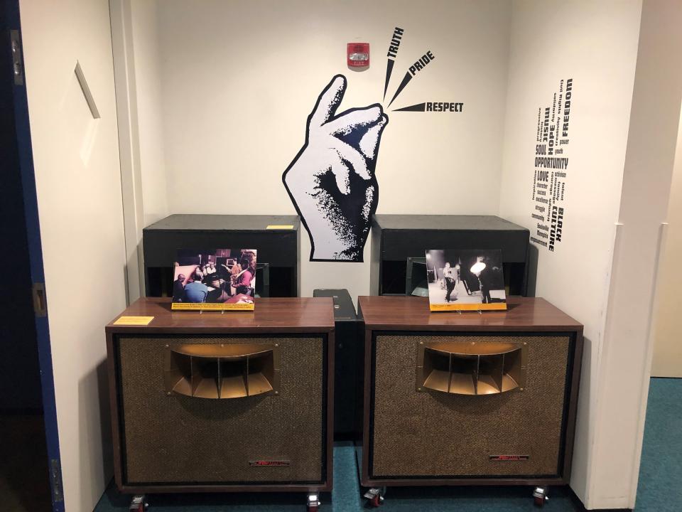 A logo, photos and a set of speakers are part of the exhibits at the Stax Museum of American Soul Music on Wednesday, Sept. 14, 2022, in Memphis, Tenn. (AP Photo/Adrian Sainz).