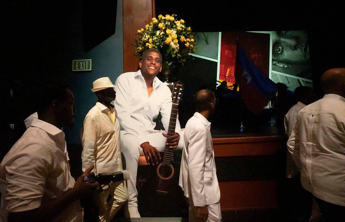 The crowd reacts at the memorial service in Miramar on Sunday held for Haitian singer Mikaben, who died in Paris three weeks ago.