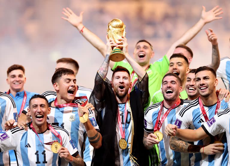 LUSAIL CITY, QATAR - DECEMBER 18: Lionel Messi of Argentina lifts the FIFA World Cup Qatar 2022 Winner's Trophy during the FIFA World Cup Qatar 2022 Final match between Argentina and France at Lusail Stadium on December 18, 2022 in Lusail City, Qatar. (Photo by Julian Finney/Getty Images)