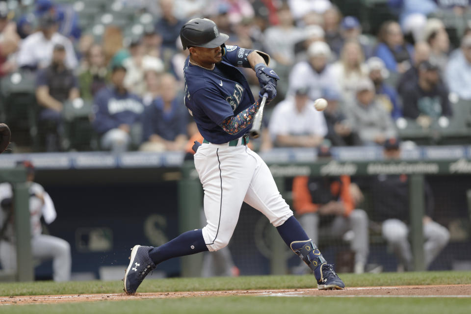 Seattle Mariners' Julio Rodriguez hits a solo home run on a pitch from Detroit Tigers starting pitcher Tyler Alexander during the first inning of a baseball game, Wednesday, Oct. 5, 2022, in Seattle. (AP Photo/John Froschauer)