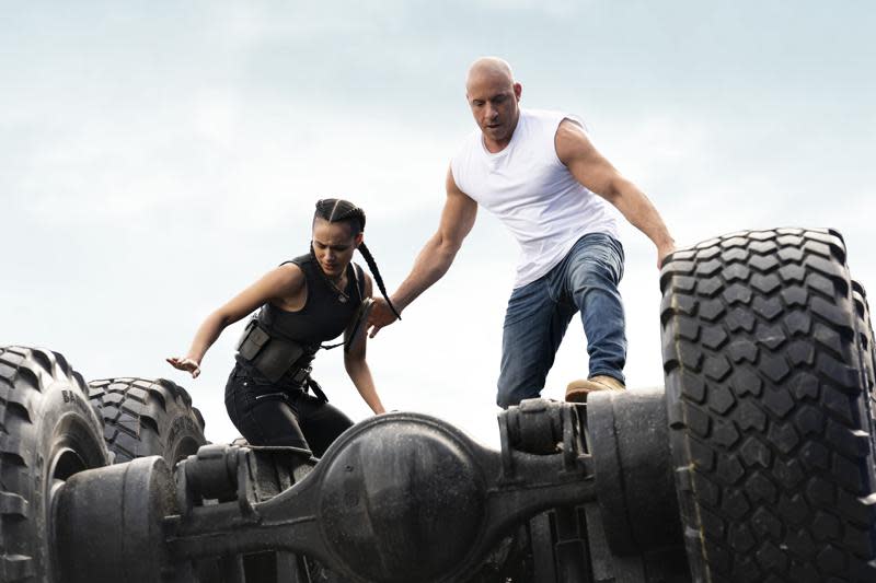 This image released by Universal Pictures shows Nathalie Emmanuel, left, and Vin Diesel in a scene from “F9.” (Giles Keyte/Universal Pictures via AP)