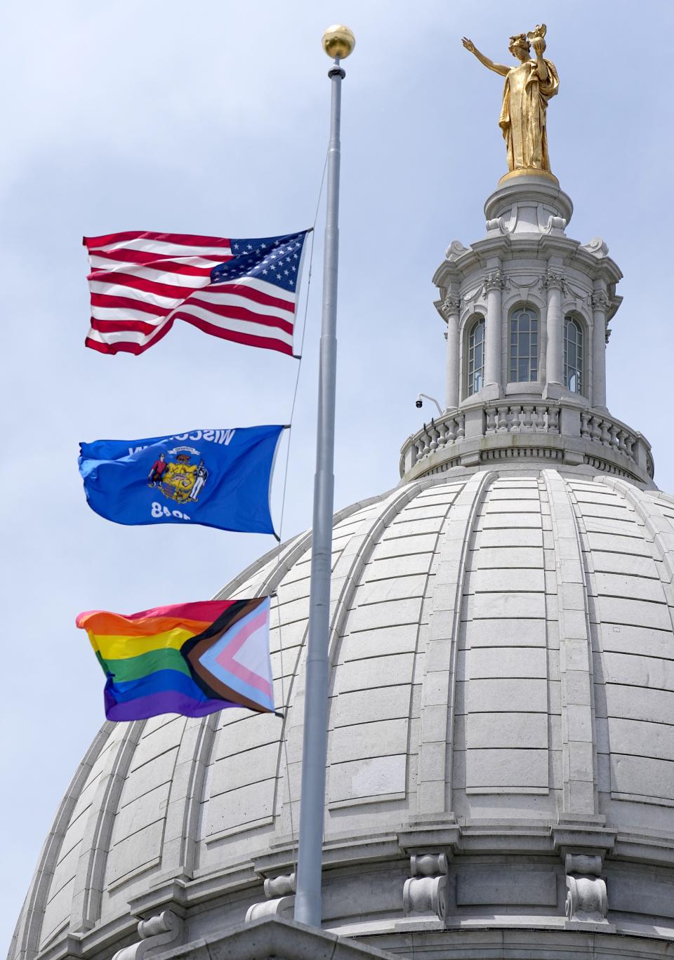 An LGBTQ flag is raised Wednesday, June 1, 2022, at the Capitol in Madison, Wis. The symbol of lesbian, gay, bisexual and transgender pride will be flown over the Capitol’s East Wing in recognition of LGBTQ Pride Month, which runs until the end of June. In June 2019, Gov. Tony Evers issued an executive order to raise the pride flag above the state Capitol for the first time in Wisconsin history. This is the fourth year the flag has flown below the U.S. and state flags on the east-wing flagpole.