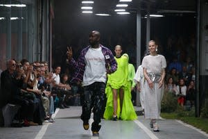 Designer Virgil Abloh accepts applause at the end of his the Off White Spring/Summer 2019 ready to wear fashion collection presented in Paris, Thursday, Sept. 27, 2018.