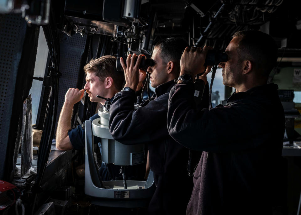 US navymen scan the horizon while standing watch in the Taiwan Strait on August 23, 2019. 