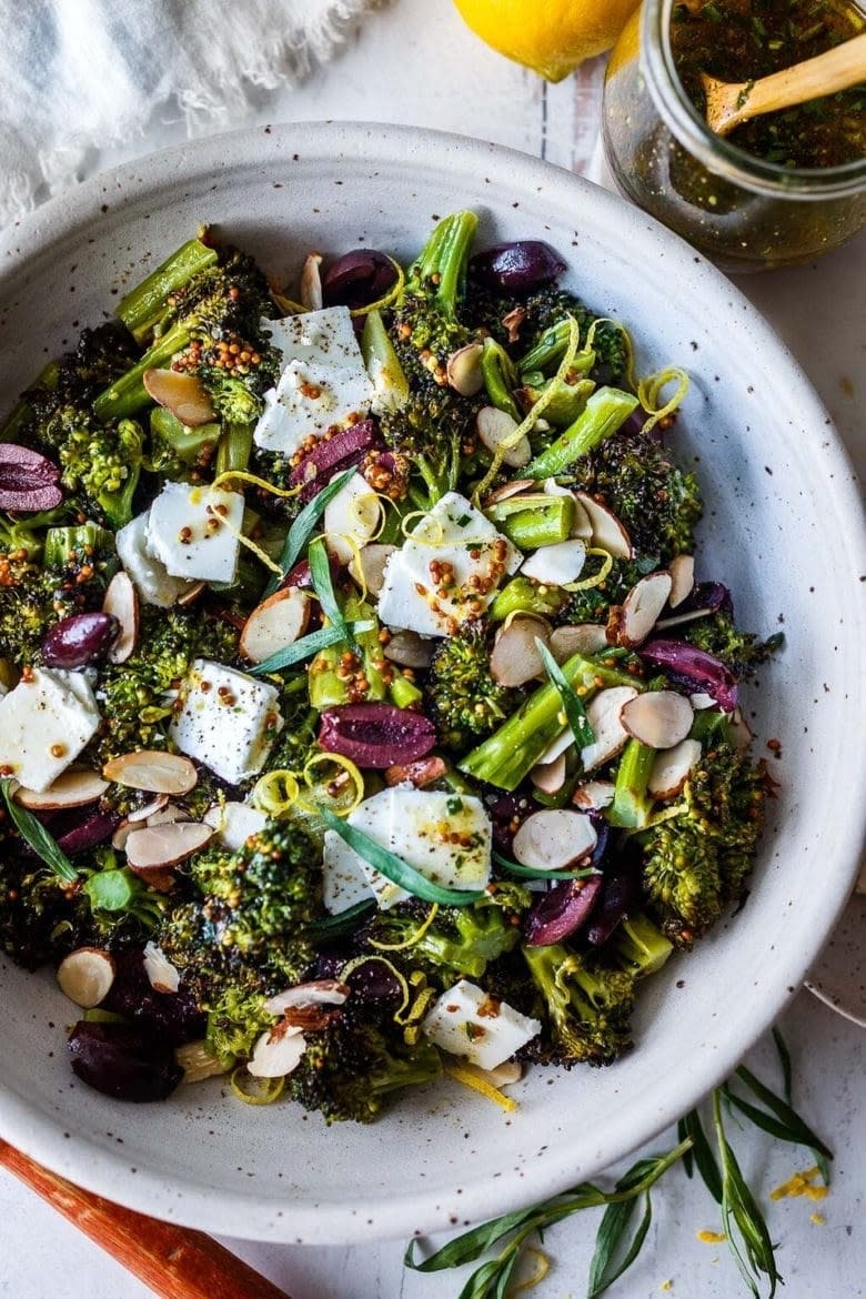 Roasted broccoli salad with olives and feta cheese.