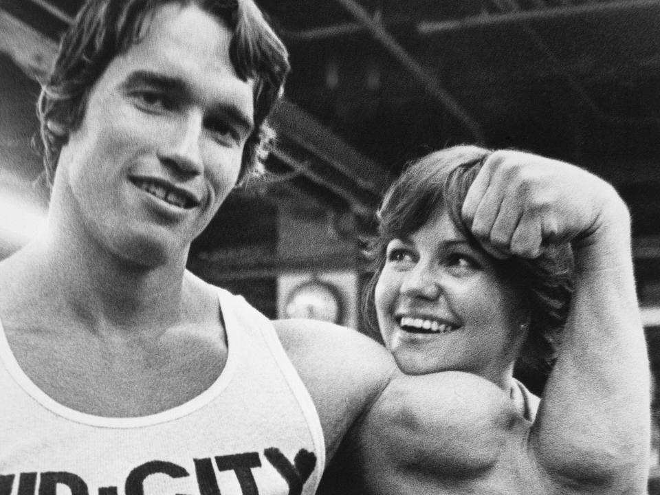 Arnold Schwarzenegger and the actress Sally Field posing for a photo.