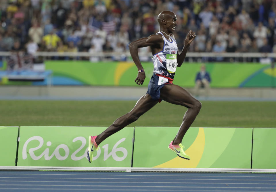 FILE - Britain's Mo Farah runs in the men's 5000- meter final during athletics competitions at the Summer Olympics inside Olympic stadium in Rio de Janeiro, Brazil, Saturday, Aug. 20, 2016. Four-time Olympic champion Mo Farah has disclosed he was brought into Britain illegally from Djibouti under the name of another child. The British athlete made the revelation in a BBC documentary. (AP Photo/Jae C. Hong, File)