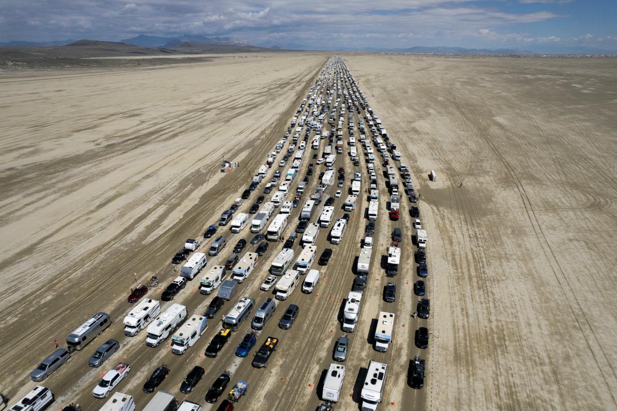Vehicles are seen departing the Burning Man festival in Black Rock City, Nevada (REUTERS)
