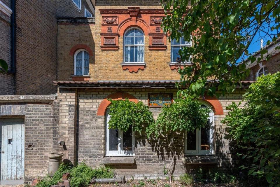 From the exterior, the three-bedroom coach house seems like a fairly typical London period home (John D Wood | Rightmove)