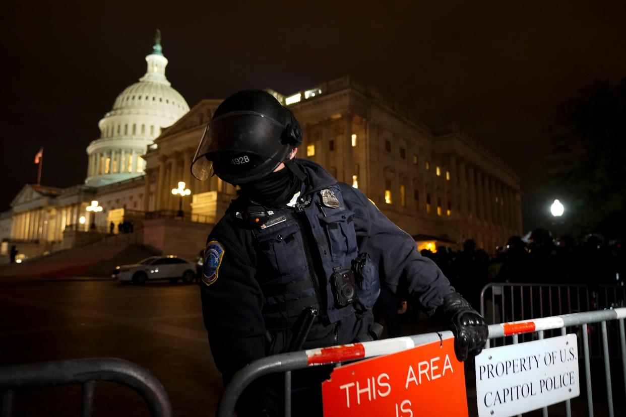 Authorities secure the area outside the U.S. Capitol, Wednesday, Jan. 6, 2021, in Washington.
