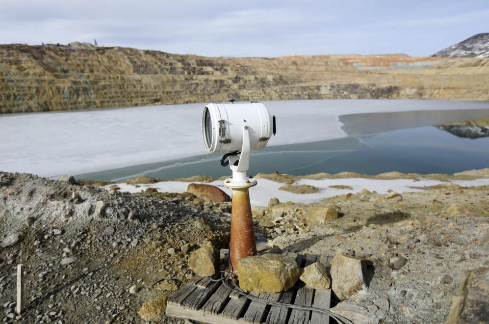 In this March 5, 2020, photo, a spotlight that was once used at a prison is now used to haze migrating birds that might choose to land on the toxic Berkeley Pit water in Butte, Montana. The Trump administration is moving to scale back criminal enforcement of a century-old law protecting most American wild bird species. Mark Thompson, the manager of environmental affairs at Montana Resources, said it would keep up the efforts that drive away almost all birds regardless of the Trump administration’s actions, mirroring pledges from some other companies and industries. (Meagan Thompson/The Montana Standard via AP)