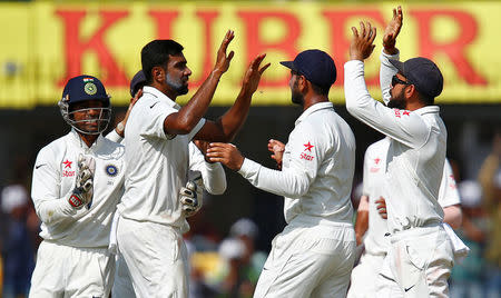 Cricket - India v New Zealand - Third Test cricket match - Holkar Cricket Stadium, Indore, India - 11/10/2016. India's players celebrate after the wicket of New Zealand's Kane Williamson. REUTERS/Danish Siddiqui