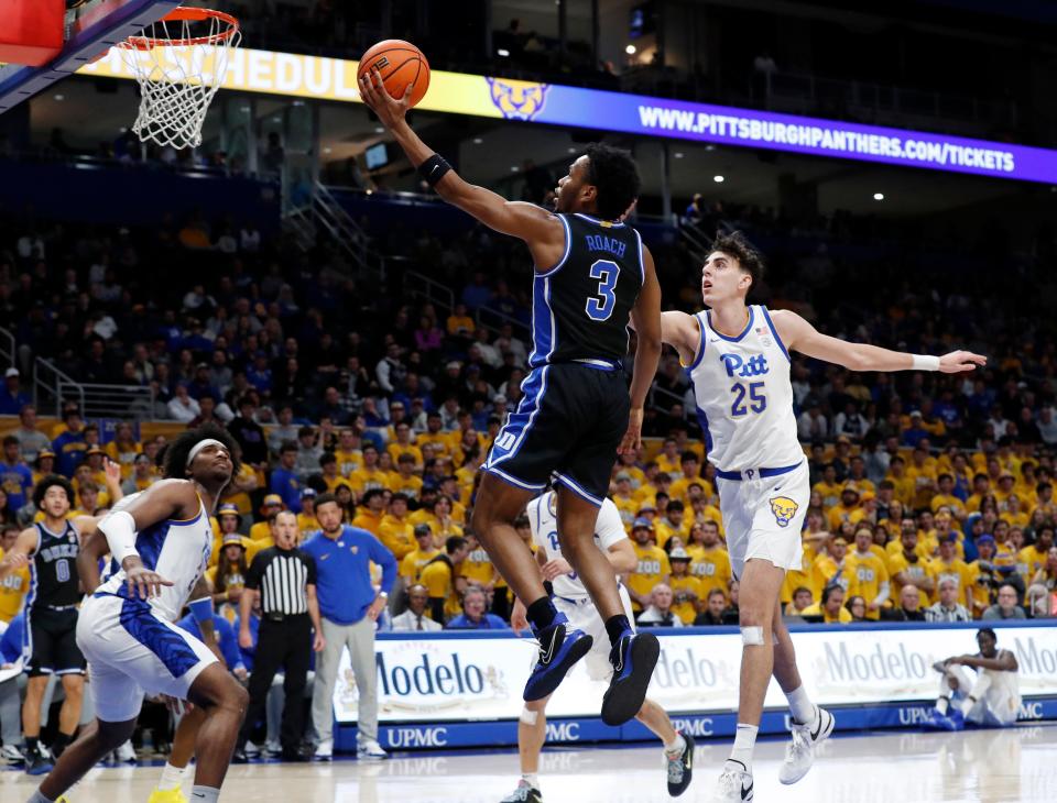 Jan 9, 2024; Pittsburgh, Pennsylvania, USA; Duke Blue Devils guard Jeremy Roach (3) goes to the basket past Pittsburgh Panthers forward Guillermo Diaz Graham (25) during the first half at the Petersen Events Center. Mandatory Credit: Charles LeClaire-USA TODAY Sports