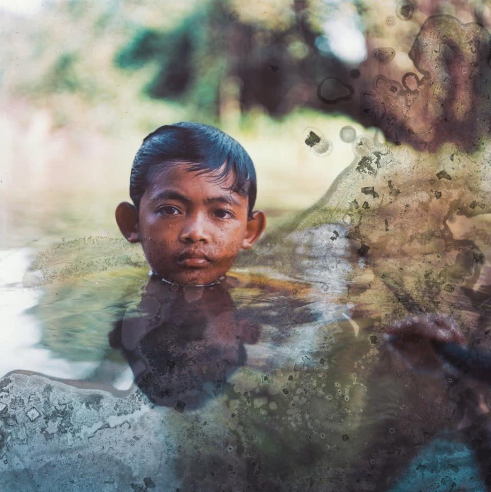 MengHy, 12, swimming by his grandfather&#x002019;s floating house (Lim Sokchanlina/Save the Children)