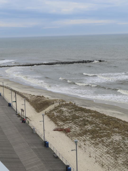 Only a narrow strip of sand sits between the ocean waves and the dunes in front of the Ocean Casino Resort in Atlantic City N.J. on March 13, 2024. The Ocean, Resorts and Hard Rock casinos want the federal government to accelerate a beach replenishment project so that they have usable beaches this summer, but the U.S. Army Corps of Engineers says it could be fall before the work begins. (AP Photo/Wayne Parry)