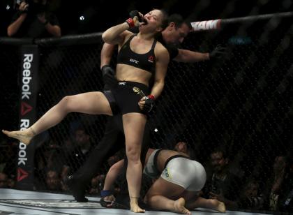 Ronda Rousey (L) celebrates after defeating Bethe Correia at UFC 190. (Reuters)