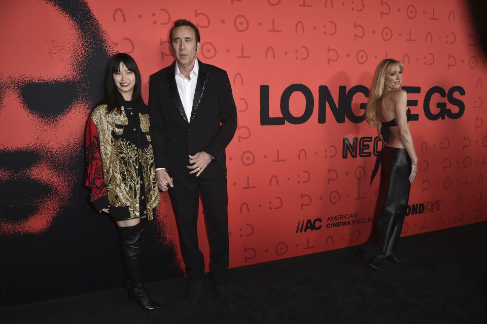 Riko Cage, from left, Nicolas Cage and Maika Monroe arrive at the premiere of "Longlegs" at the Egyptian Theatre on Monday July 8, 2024, in Los Angeles. (Photo by Richard Shotwell/Invision/AP)