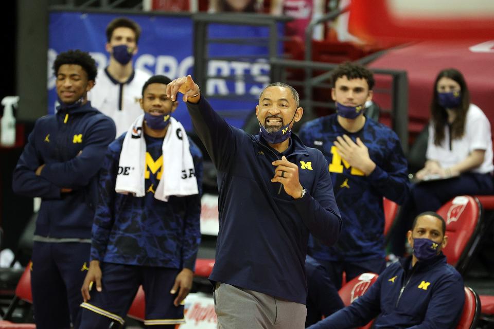 Juwan Howard coaches during the second half against Wisconsin at Kohl Center.