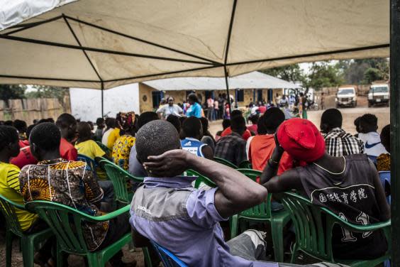 Former child soldiers wait for a medical assessment before receiving an aid package in Yambio