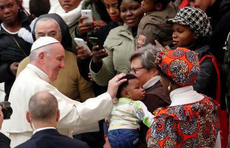 FILE PHOTO: Pope Francis speaks to a group of migrants during the weekly general audience at the Vatican, December 19, 2018. REUTERS/Max Rossi/File Photo