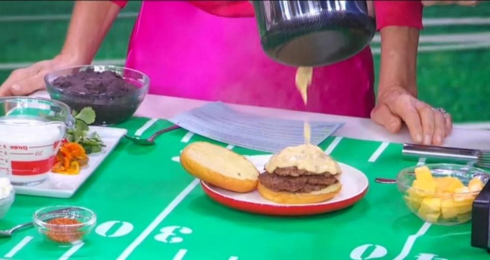 PHOTO: Chef Antonia Lofaso tops her triple touchdown smash burger with homemade queso dip. (ABC News)