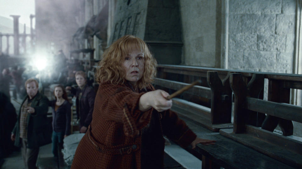 Molly Weasley in battle stance with wand ready in a scene from "Harry Potter and the Deathly Hallows: Part 2"