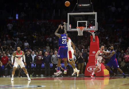 December 9, 2017; Los Angeles, CA, USA; Los Angeles Clippers guard Lou Williams (23) shoots a three point basket against the Washington Wizards during the second half at Staples Center. Mandatory Credit: Gary A. Vasquez-USA TODAY Sports