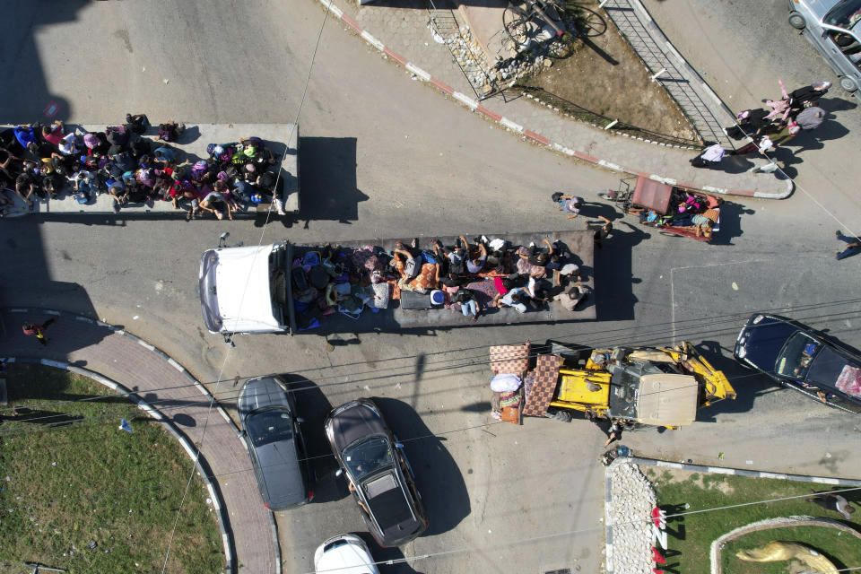 Palestinians fleeing from northern Gaza to the south after the Israeli army issued an unprecedented evacuation warning to a population of over 1 million people in northern Gaza and Gaza City to seek refuge in the south ahead of a possible Israeli ground invasion, Friday, Oct. 13, 2023. (AP Photo/Hatem Moussa)