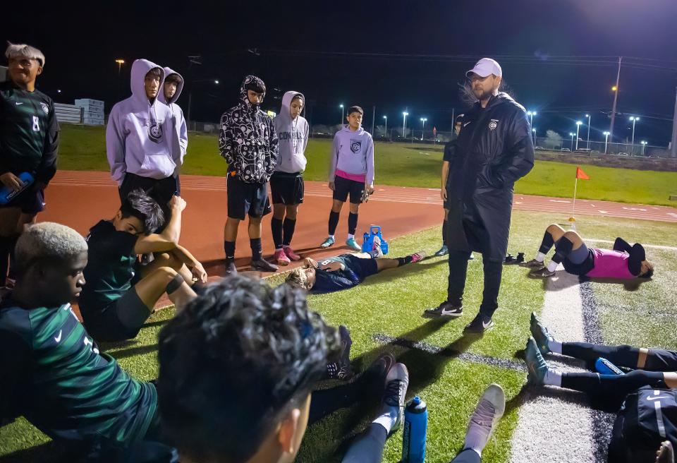 Connally boys soccer coach Ryan Ford talks to his team during halftime of their district game against Georgetown on Feb. 16. The Cougars shut out Crockett 6-0 on Monday night in a Class 5A bi-district playoff to advance to the area round this weekend.