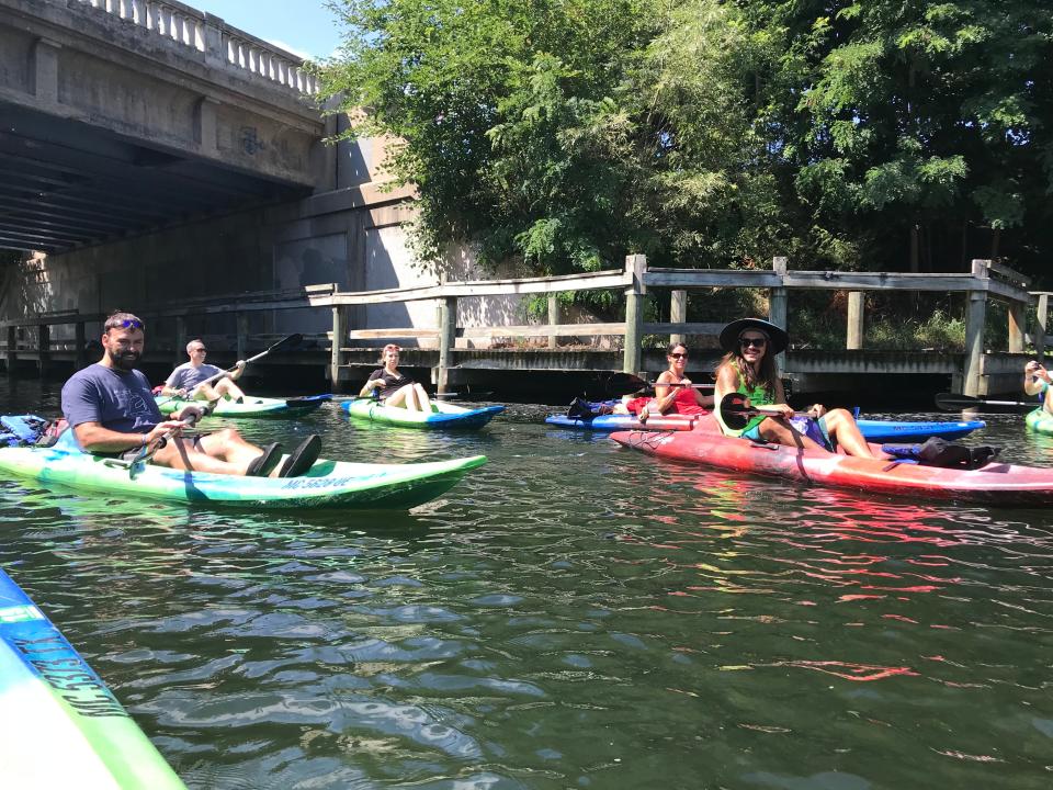 Kayakers on the Boardman River in Traverse City, traveling from brewery to brewery, during "Paddles for Pints" in 2018.