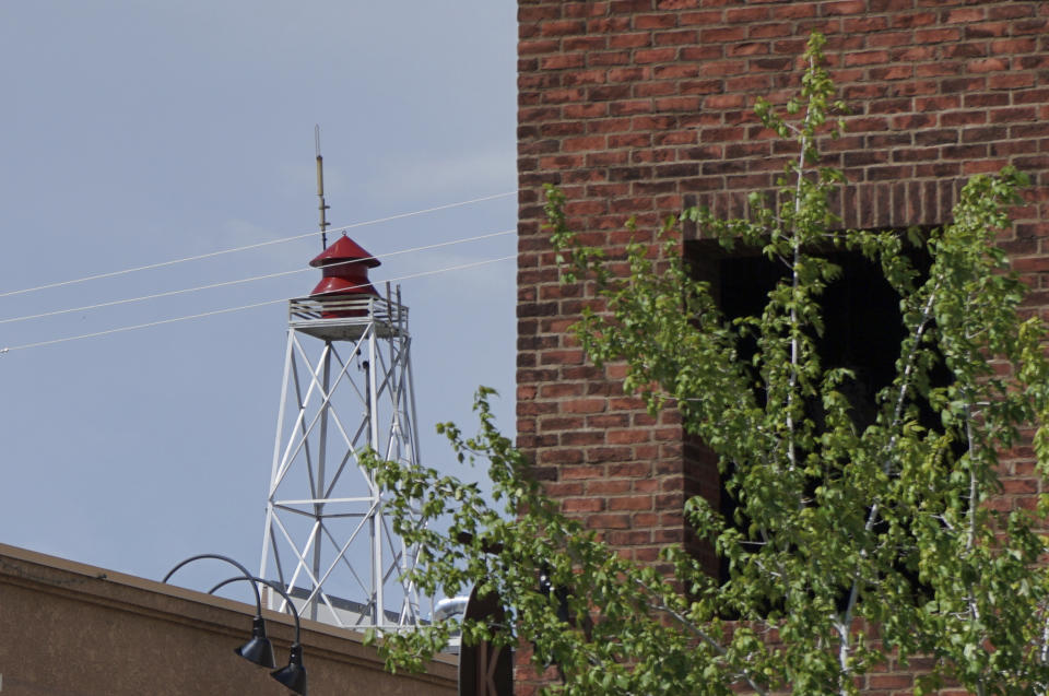 This June 30 2021 photo shows a century-old siren in Minden, Nev. Efforts to silence the century-old siren that blares every night at 6 p.m. are sparking debates over how to confront the region's history of racism and violence. The Washoe Tribe of Nevada and California associates the siren with a historic "sundown ordinance" that once made it illegal for them to be in Minden and neighboring Gardnerville after nightfall. Residents of the mostly white town defend it as a tradition that marks time and honors first responders. (AP Photo/Sam Metz)