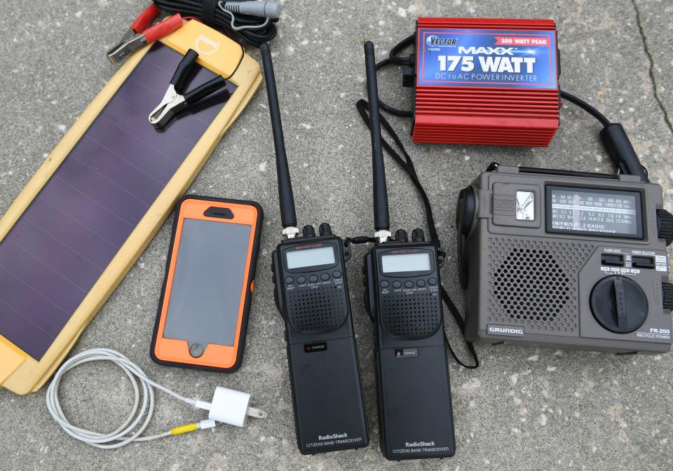 Electronics:  A battery/hand-crank AM/FM/shortwave radio will let you stay in touch with the news. Hand-held CB radios will work when cellphones donÕt. Both also receive NOAA weather radio broadcasts. A small solar cell for charging mobile phones and a 12-volt inverter will let you run some 110-volt devices while your car is running.[Herald-Tribune staff photo / Mike Lang]