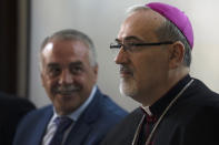 The Latin Patriarch of Jerusalem Pierbattista Pizzaballa, right, and Jamil Koussa, General Director of St. Joseph's Hospital, give a press conference about police violence against pallbearers at the funeral of slain Al Jazeera correspondent Shireen Abu Akleh, in east Jerusalem, Monday, May 16, 2022. Pizzaballa, the top Catholic clergyman in the Holy Land, said Israel's police attack on mourners during a funeral for Abu Akleh was a violation of human rights and disrespected the Catholic Church. (AP Photo/ Maya Alleruzzo)