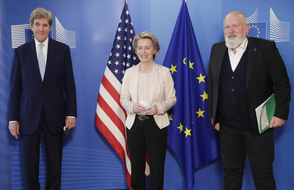 FILE - In this March 9, 2021 file photo, United States Special Presidential Envoy for Climate John Kerry, left, European Commission President Ursula von der Leyen, center, and European Commissioner for European Green Deal Frans Timmermans pose for photographers prior to a meeting at EU headquarters in Brussels. The European Union reached a tentative climate deal on Wednesday, April 21, 2021 that should make the 27-nation bloc climate-neutral by 2050, with member states and parliament agreeing on the targets on the eve of a virtual summit that U.S. President Biden will host. (Olivier Hoslet, Pool via AP, File)