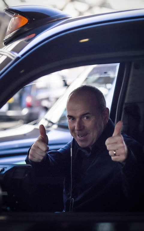 A taxi driver reacts outside Paddington Station - Credit: PA