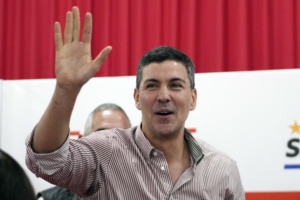 Paraguayan President-elect Santiago Pena waves after giving a press conference in Asuncion, Paraguay, Tuesday, May 2, 2023. Peña, a 44-year-old economist and former finance minister, won Sunday's election. (AP Photo/Jorge Saenz)