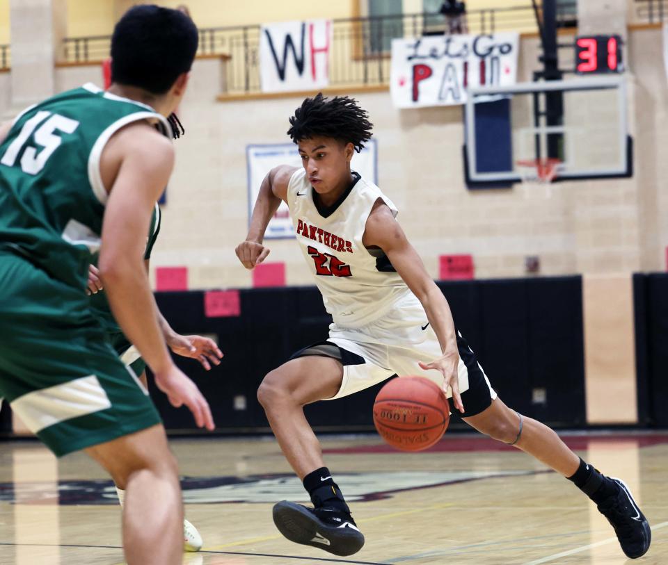 Whitman-Hanson's Isaiah Bean-Brittian dribbles to the basket during a game versus Marshfield on Friday, Feb. 10, 2023.