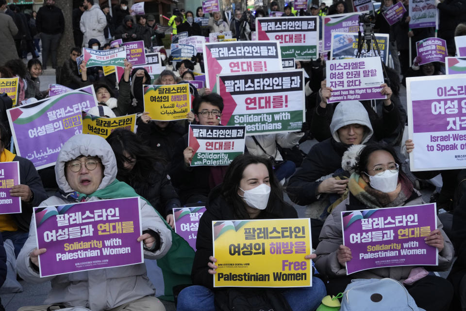 Protesters stage a rally marking International Women's Day in Seoul, South Korea, Friday, March 8, 2024. (AP Photo/Ahn Young-joon)