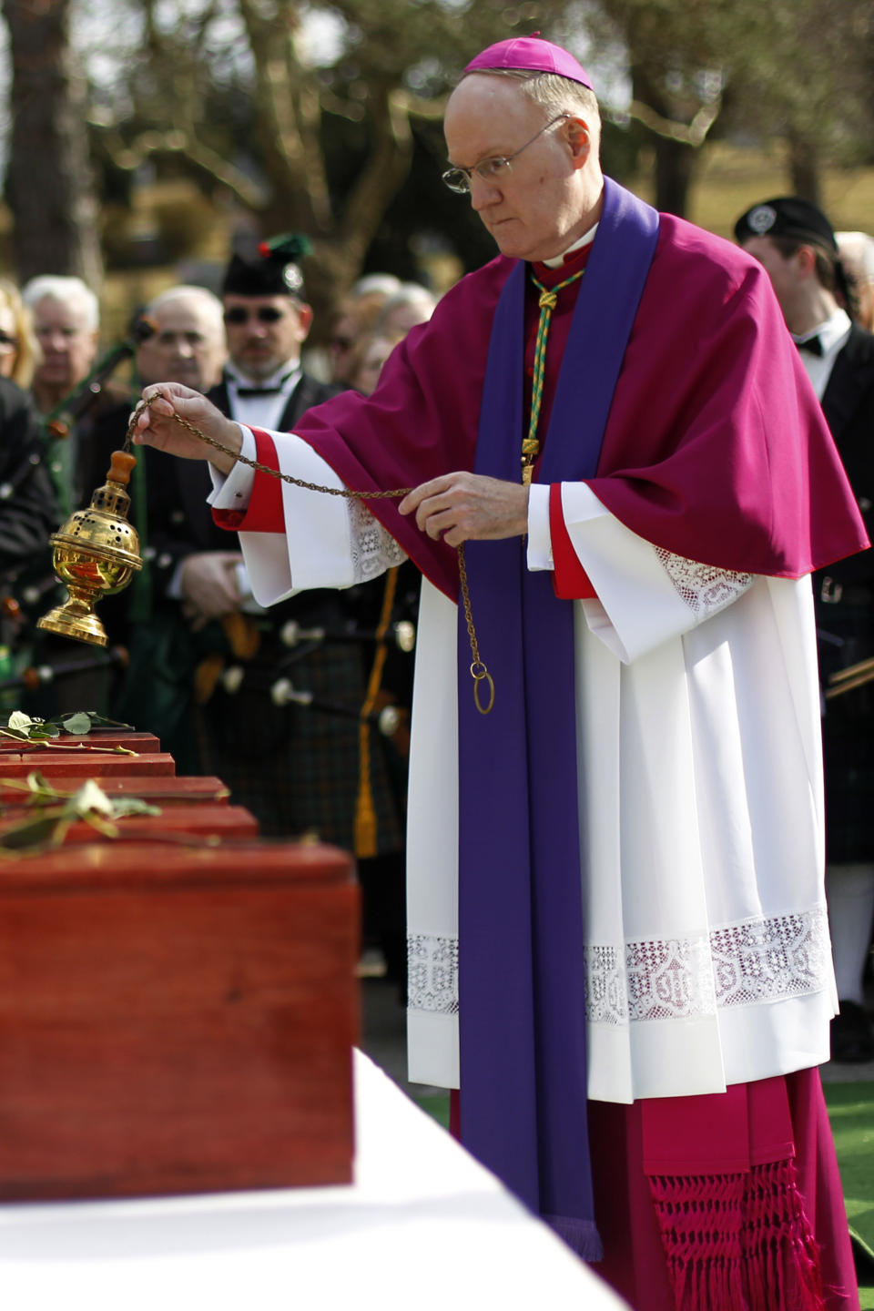 FILE - In this March 9, 2012 file photo, Bishop Michael J. Fitzgerald takes part in a funeral at West Laurel Hill Cemetery in Bala Cynwyd, Pa., for five 19th-century Irish immigrants whose remains were excavated from the Duffy's Cut site. Bishop Fitzgerald is among 13 men Pope Francis admires, resembles and has chosen to honor as the 13 newest cardinals who will be elevated at a formal ceremony Satuday, Oct. 5, 2019. (AP Photo/Matt Rourke, File)