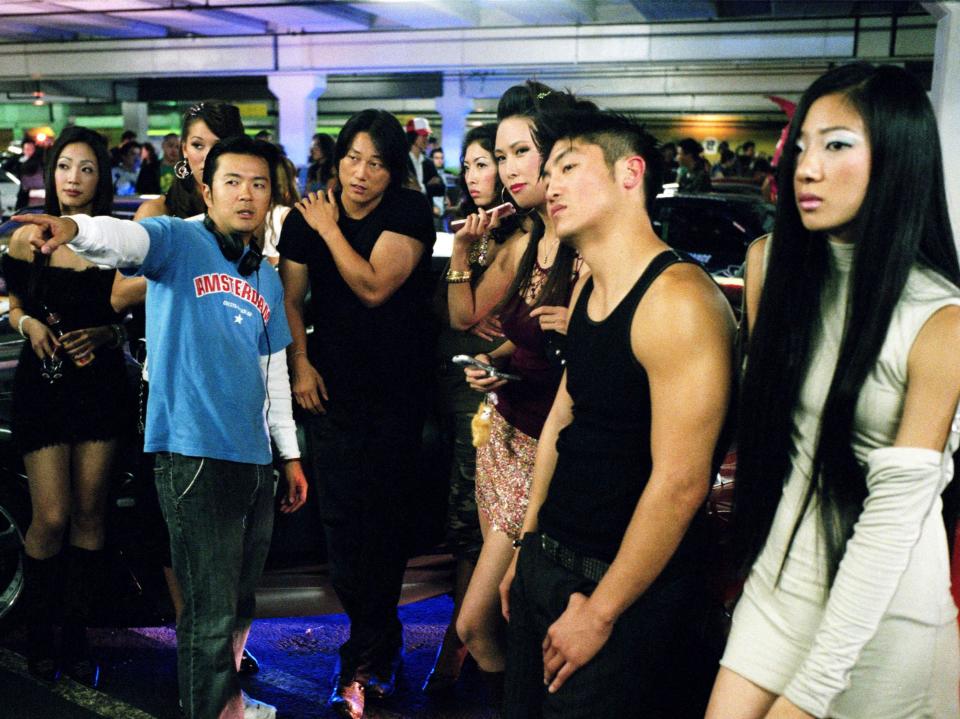 Justin Lin, Sung Kang, Brian Tee on the set of ‘Tokyo Drift’ in 2006 (Sidney Baldwin/Universal/Kobal/Shutterstock)