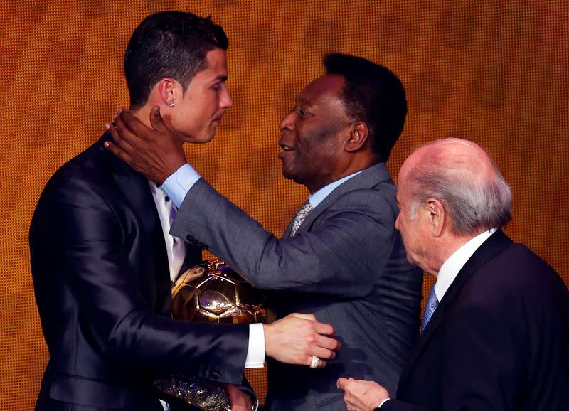 FILE PHOTO: Portugal's Cristiano Ronaldo is congratulated by Pele after being awarded the FIFA Ballon d'Or 2013 in Zurich