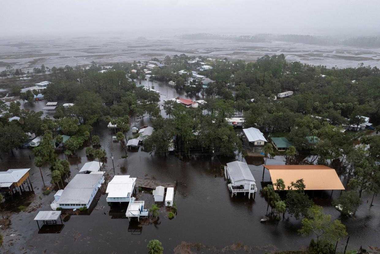 A drone view shows houses and streets flooded in Suwannee, Florida (Reuters)