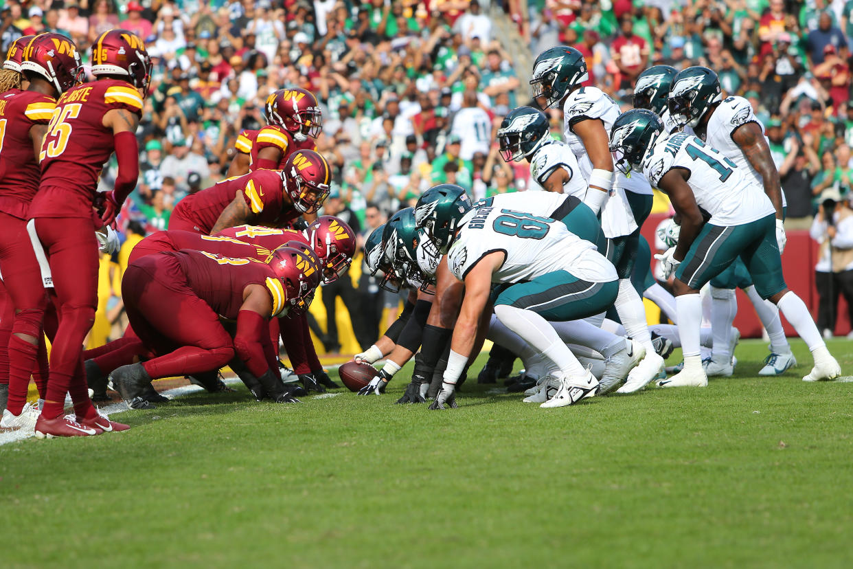 LANDOVER, MD - OCTOBER 29: Philadelphia Eagles quarterback Jalen Hurts (1) and the offense prepare to run the 'brotherly shove' during the Philadelphia Eagles game versus the Washington Commanders on October 29, 2023, at FedEx Field in Landover, MD. (Photo by Lee Coleman/Icon Sportswire via Getty Images)