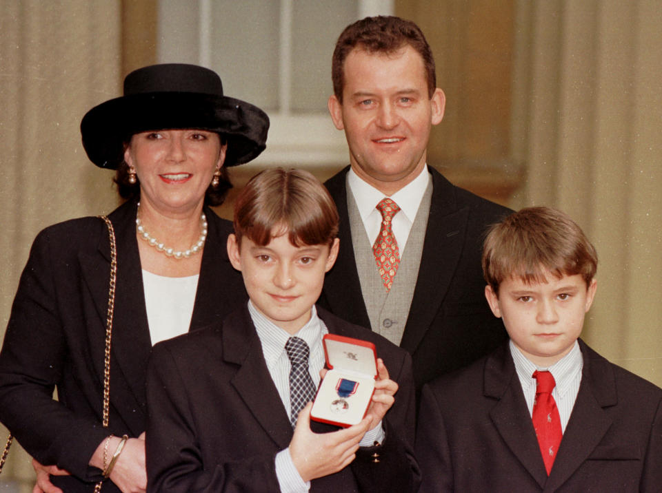 Former butler to Diana, Princess of Wales Paul Burrell with his wife Maria and sons Alex (left) and Nicky outside Buckingham Palace where Mr Burrell had been presented with the Royal Victorian Medal by the Queen   (Photo by John Stillwell - PA Images/PA Images via Getty Images)