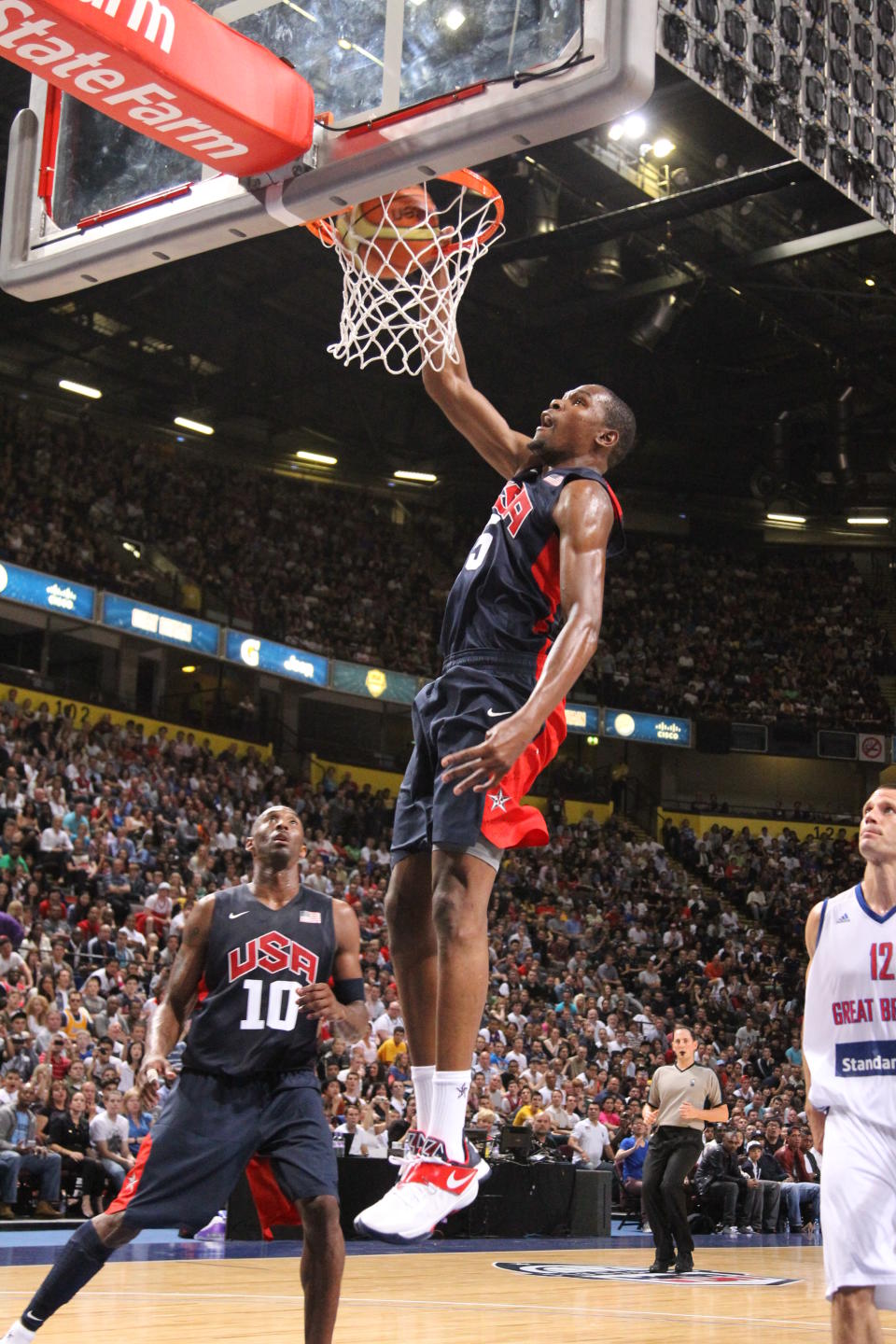 MANCHESTER, UK - JULY 19: Kevin Durant #5 of the 2012 US Men's Senior National Team dunks during an exhibition game against Great Britain's Men's team at the Manchester Arena on July 19, 2012 in Manchester, UK.