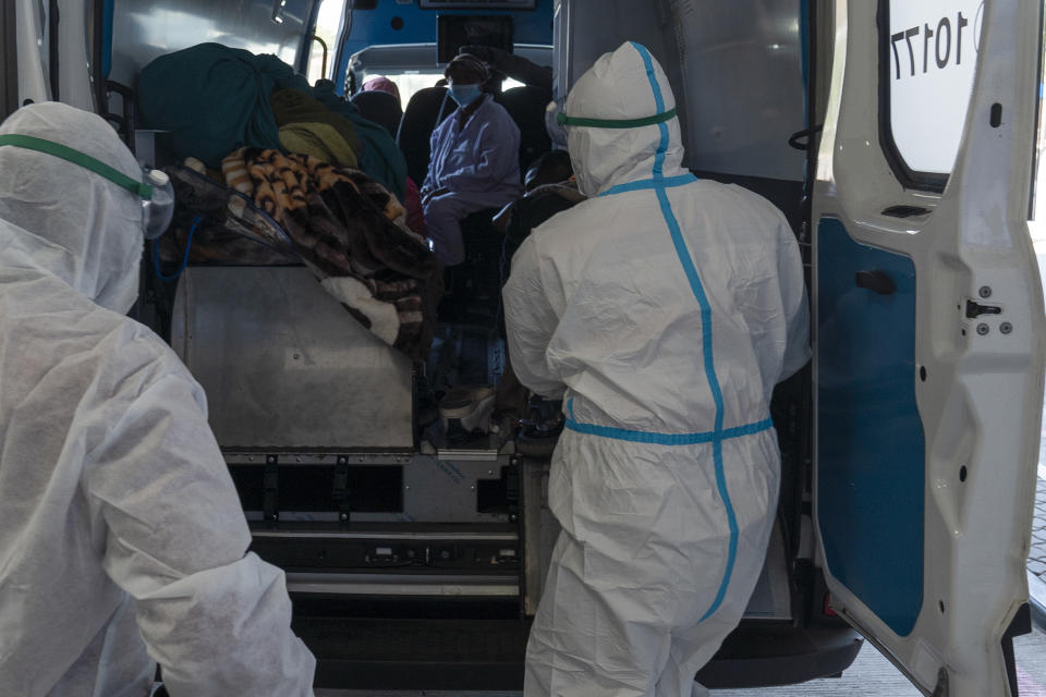 Health workers arrive with a patient at the Chris Hani Baragwanath Academic Hospital's Covid-19 facility in Johannesburg. Source: AP