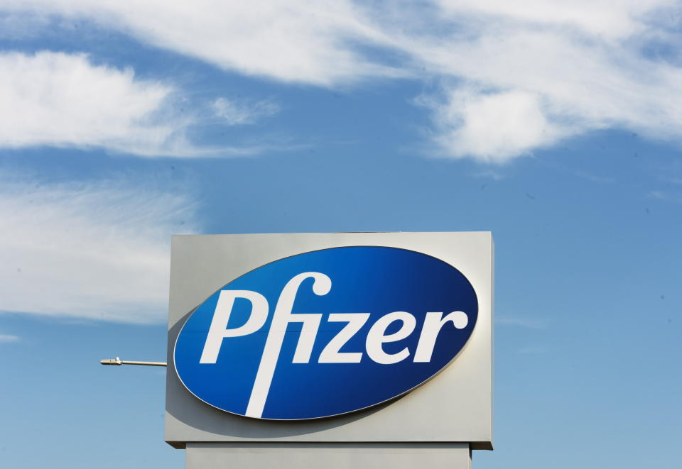 FILE - In this Monday, Nov. 9, 2020, file photo, a sign with the Pfizer logo stands outside the corporate headquarters of Pfizer Canada in Montreal. Pfizer announced Wednesday, Nov. 18, 2020, more results in its ongoing coronavirus vaccine study that suggest the shots are 95% effective a month after the first dose. (Ryan Remiorz/The Canadian Press via AP, File)